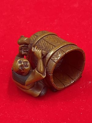 Vintage Carved Netsuke. Nice older piece that is tea stained and signed on the bottom. A man
