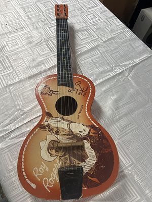 Roy Rogers and Trigger Toy Guitar. Condition is consistent with age and use, see pictures. Made