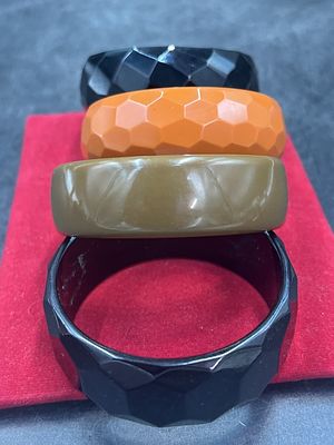 Bakelite Bracelets. Total of 4 in this lot. Majority have a faceted design and condition is good