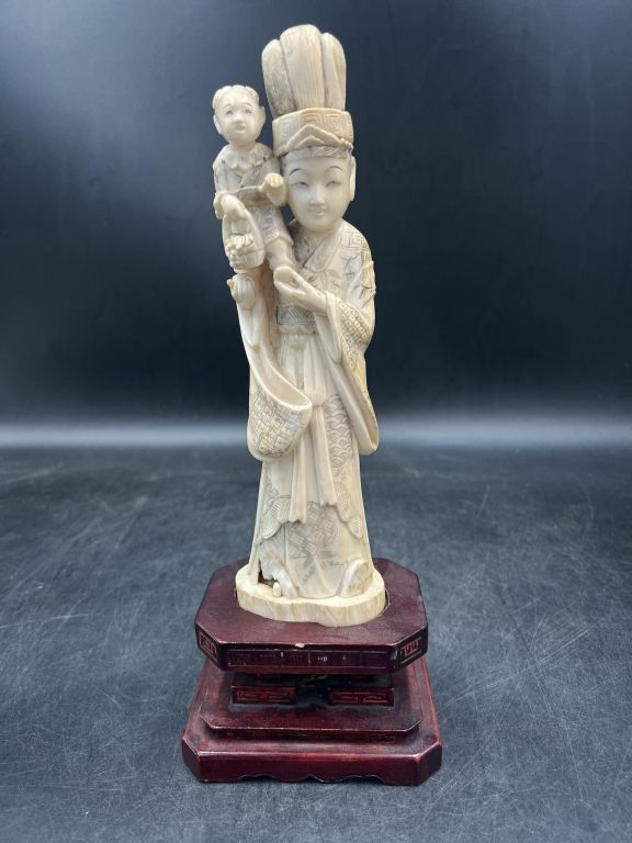 Lot 191: Vintage Carved Ivory Figure of Empress holding a Child
