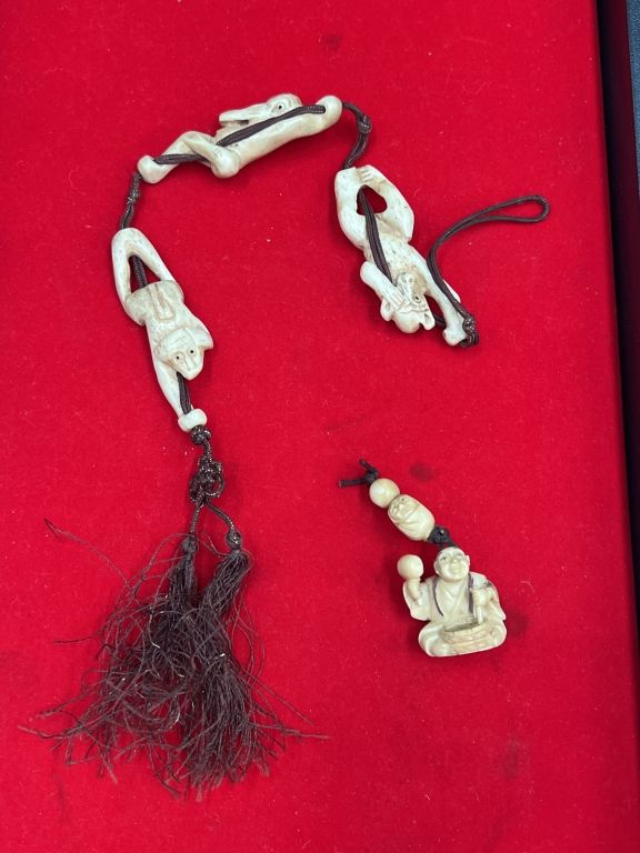 Lot 205: Vintage Carved Ivory Pieces Strung on Decorated Tassel