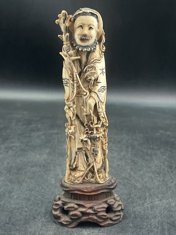 Lot 309: Early Carved Ivory Asian Figure