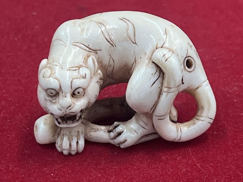 Lot 320: Carved Early Ivory Netsuke