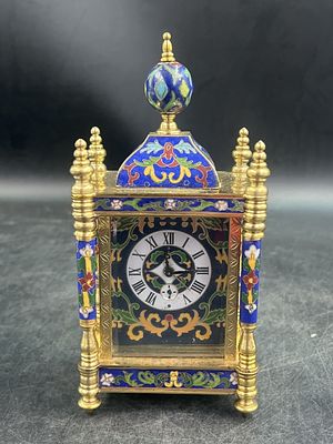Cloisonne Enamel Mantel Clock. Features glided ornate frame and vibrant blue enameled details. 