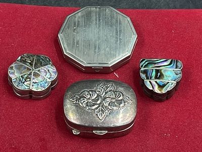 Vintage Silver Power Compacts. Small cases with intricate designs and materials like abalone 