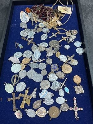 Religious Lot. This lot has rosary, crosses and pendants, etc. some silver. A mix variety of 