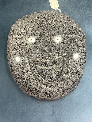 Hand Carved Whalebone "Alaska". Piece has original tag on back and is signed by artist "TAS". 