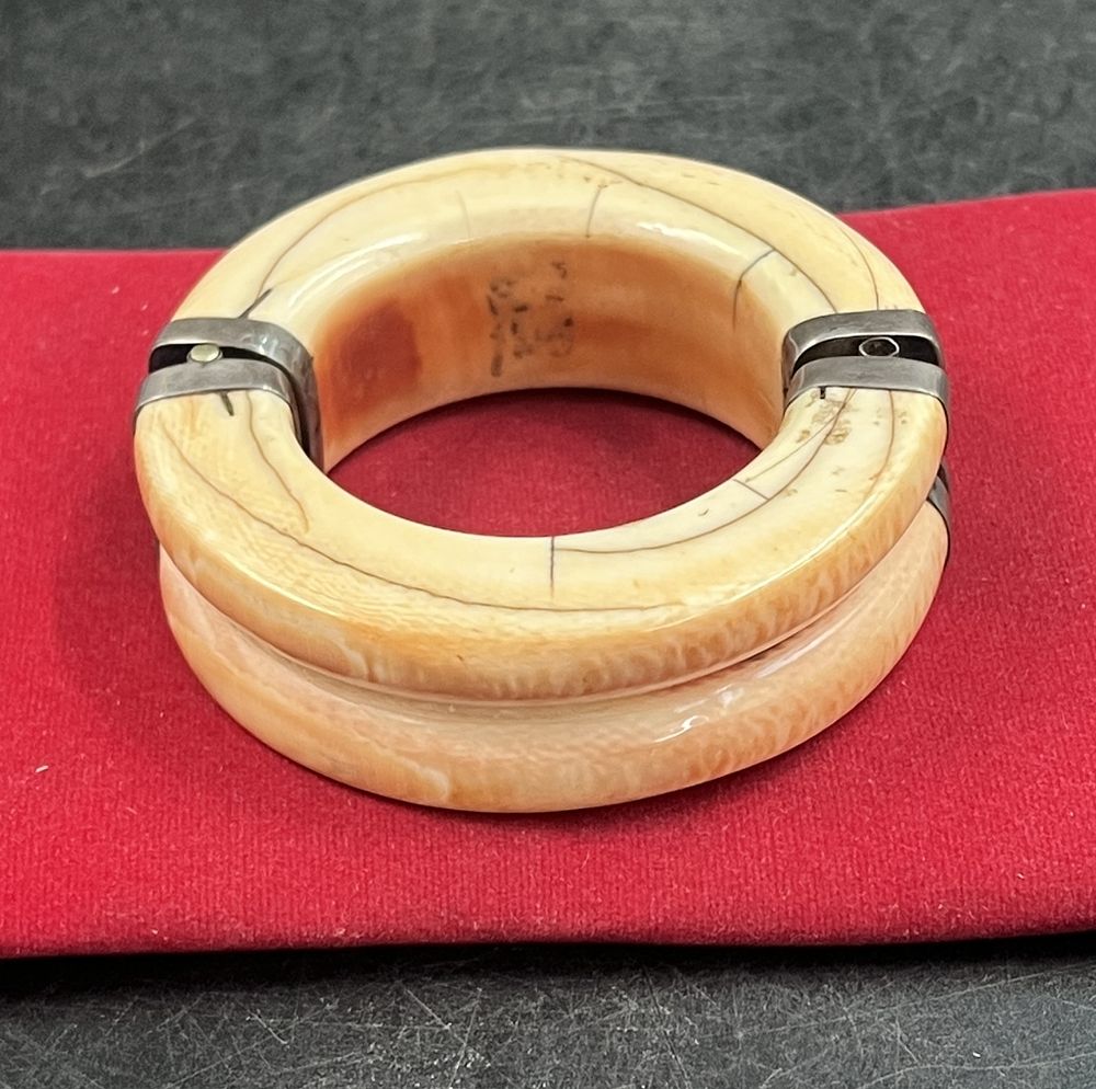 Lot 165: Antique Ivory Bangle Bracelet with Silver caps