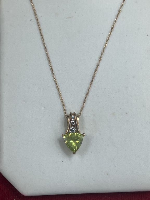 Lot 242: 10kt Gold  Peridot Pendant and Chain