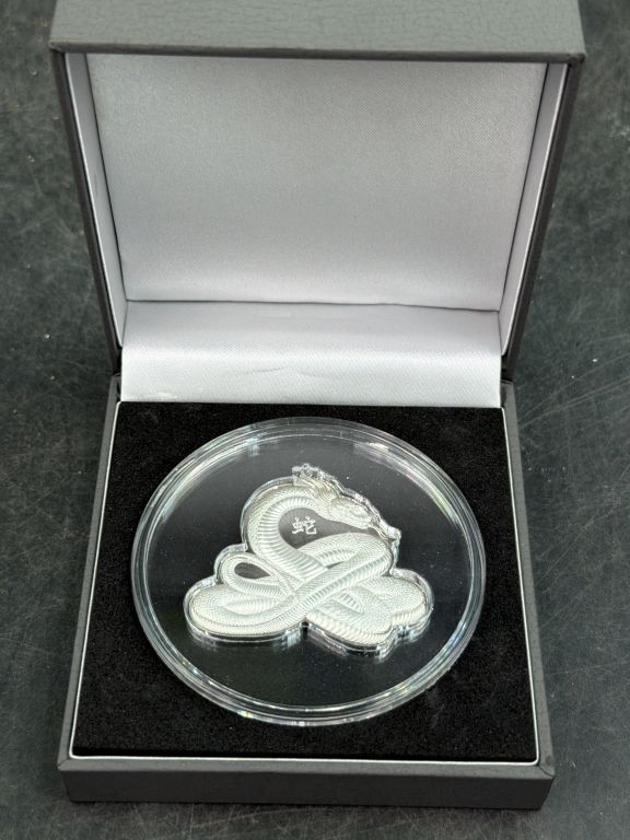 Lot 411: 2025 Cameroon Lunar Snake Shaped Silver Coin