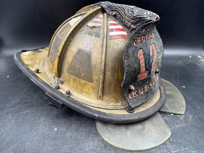 Early Vintage Leather Fire Helmet. Has a high crown segmented comb design, long rear brim front 