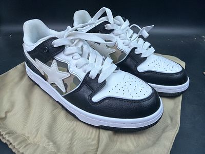 A Bathing Ape (BAPE) SK8 STA Bold #1 Sneaker. Black and white colorway with camo side panels. 