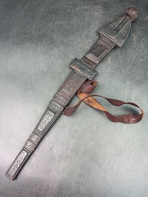 African Tuareg Dagger. Leather wrapped scabbard, distinct bulb and tribal leather patterns. 