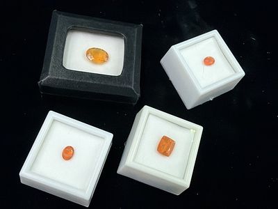 Gemstones Fire Opals. Total of 4 in protective cases. See pictures, no refunds given.