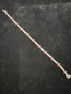 14kt White Gold Burmese Rubies/Diamond Bracelet. Stunning 14k white gold flowered tennis 