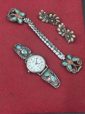 Native American Jewelry. There is a pair of earrings, watch and watch band. Turquoise and inlay 