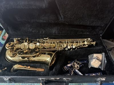 Alto Saxophone in Hardshell Case. See pictures, resting inside black velvet line hardshell case. 