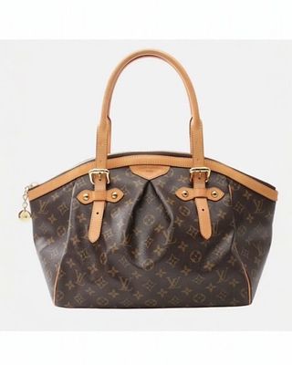 Сумка LOUIS VUITTON Tivoli GM из канвы Monogram. была названа в честь итальянского города Тиволи 