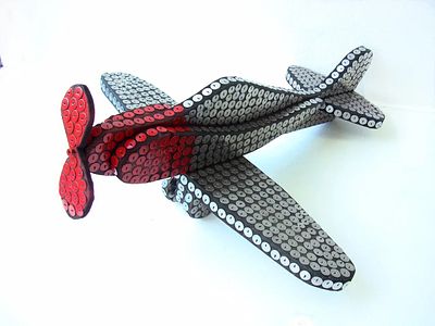 Чежин Андрей. 
Самолет. 2015. 
Дерево, тушь, металл -50х45х19. Андрей Чежин — современный 