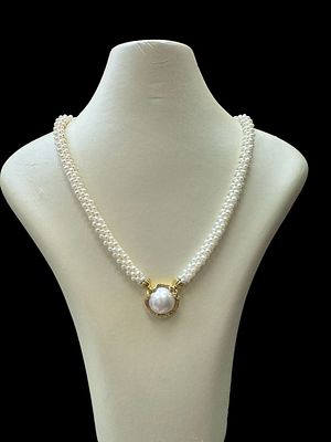 Natural pearl string 6 braided rows of 3 mm pearls with a 14K gold pendant inlaid with a 16 mm 