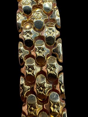 An antique red gold bracelet made of 18K gold, wide and impressive with a handmade texture on 