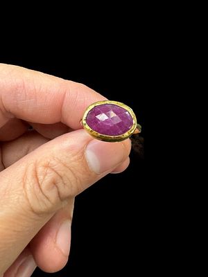 A 14K yellow gold ring set with a 3 carat oval shaped natural ruby stone. Gold weight 2.55 