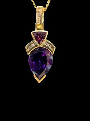 14K gold necklace with 18K gold pendant set with amasite and diamonds, the pendant has a 