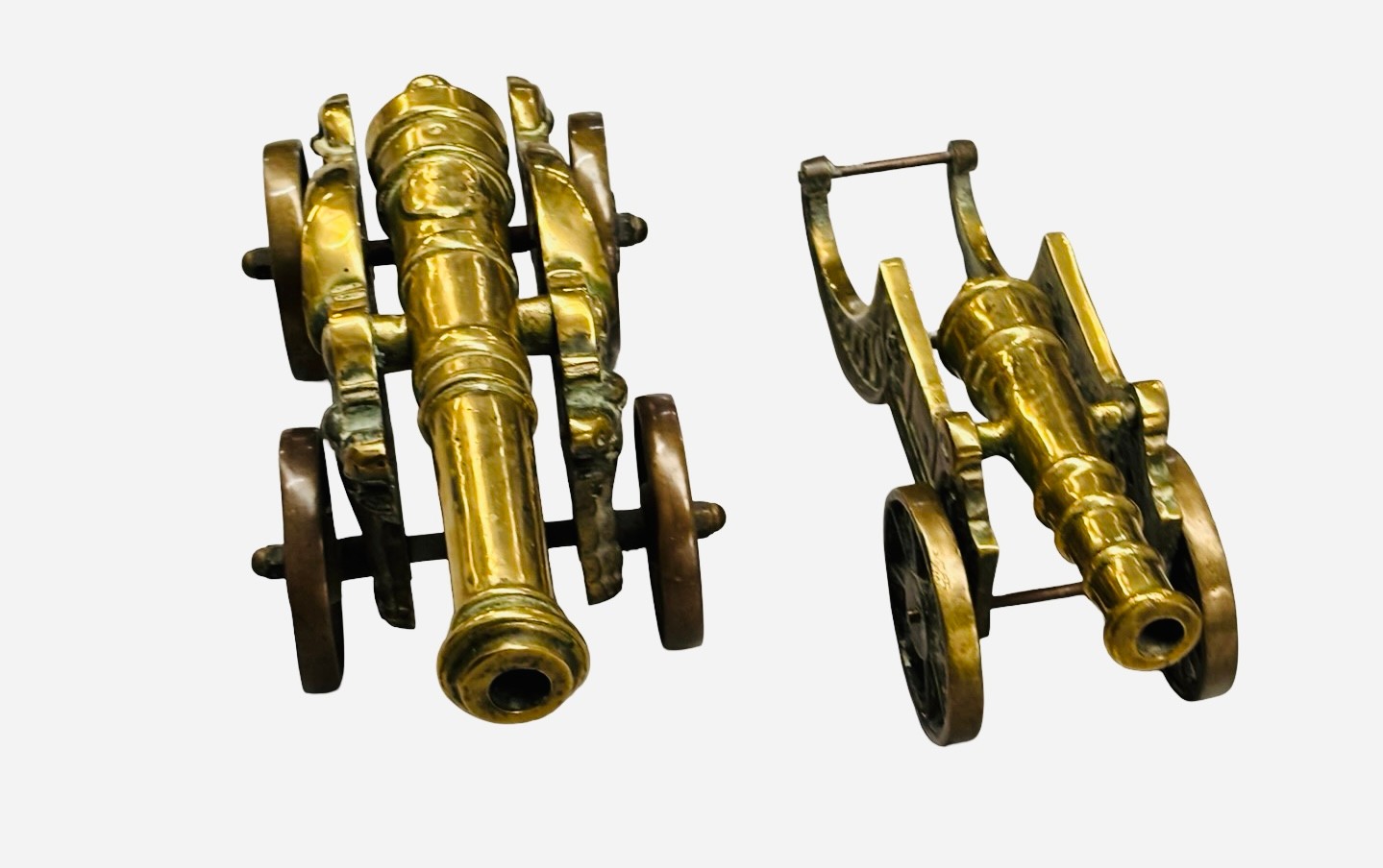 A pair of heavy brass cannon models