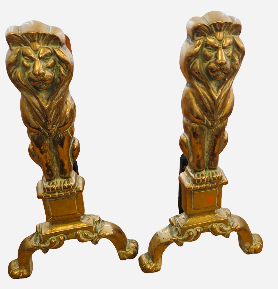 A pair of brass lion-form fireplace andirons