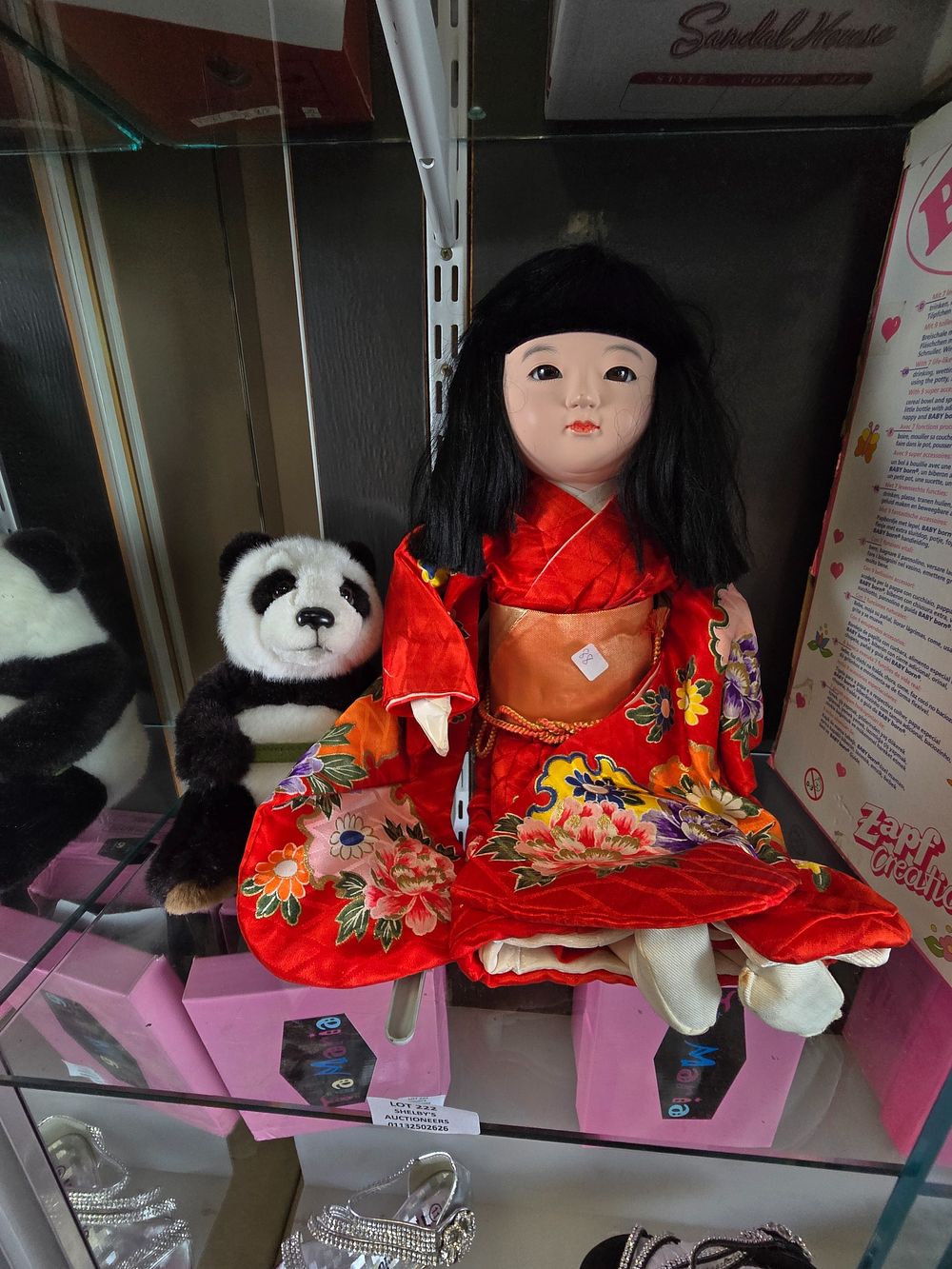 Lot 222: 1 X ORINTAL PORCLAIN HEAD DOLL WITH PLUSH...