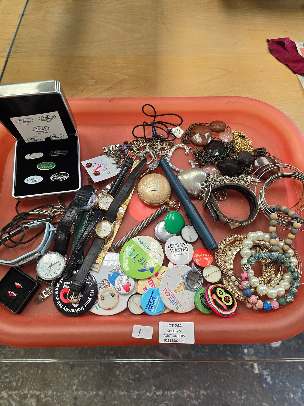 Lot 244: 1 X TRAY CONTAINING COSTUME JEWELLERY BADGES ETC