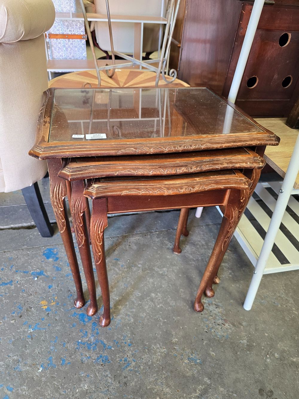 Lot 83: 1 X NEST OF MAHOGANY GLASS TOPPED TABLES