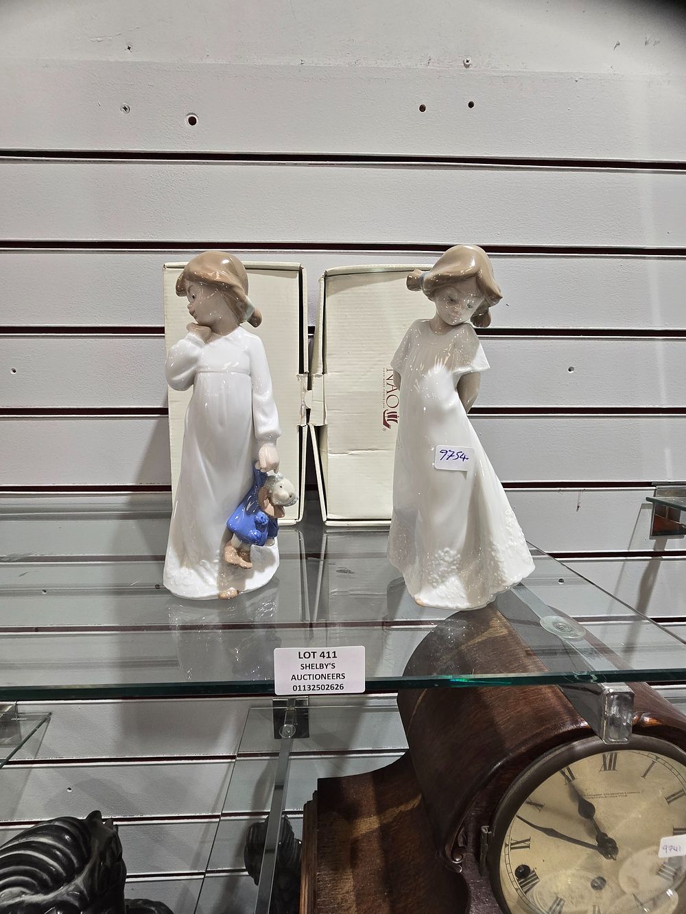 Lot 411: 2 X NAO GIRL FIGURINES ONE WITH TEDDY...