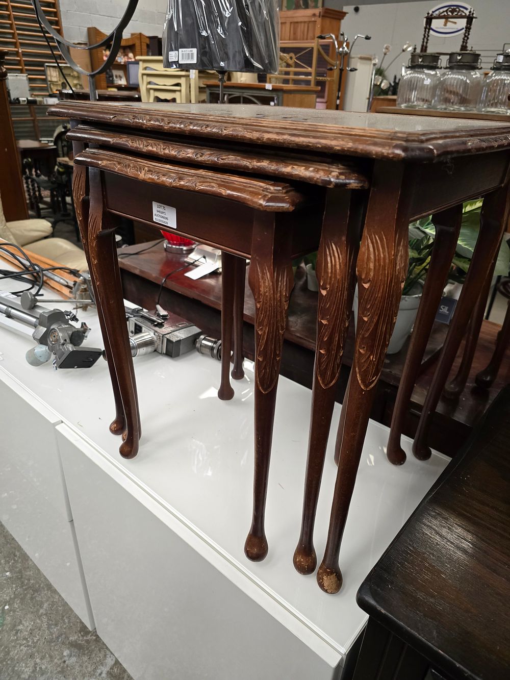 Lot 71: 1 X NEST OF MAHOGANY GLASS TOPPED TABLES