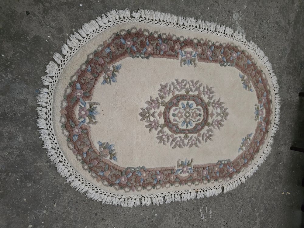 Lot 191: 1 X WOOLEN WOVEN OVAL SHAPE FLOOR RUG...