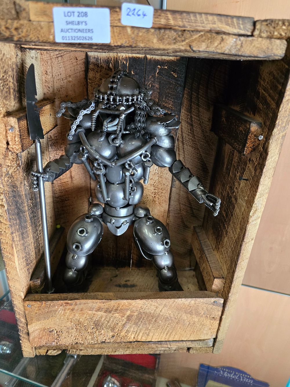 Lot 208: 1 X METAL ALIEN FIGURE IN WOODEN BOX