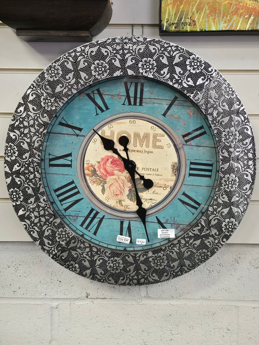 Lot 316: 1 X LARGE SILVER EMBOSSED SYLE WALL CLOCK...