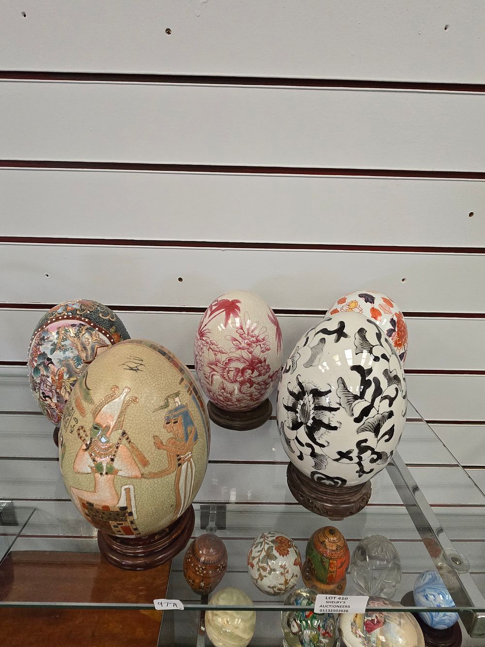 Lot 410: 5 X VARIOUS LARGE PORCELAINE EGGS ON STANDS