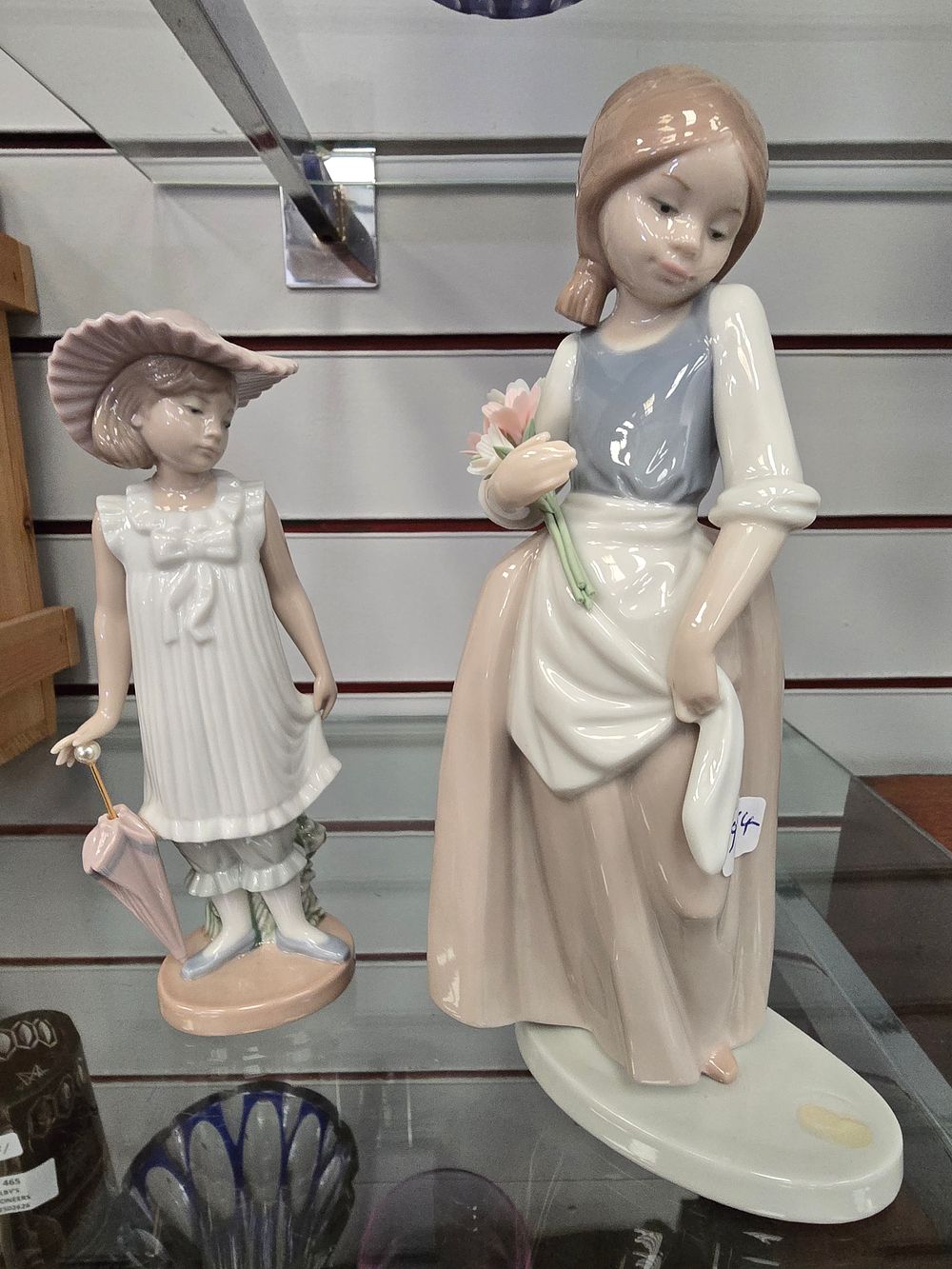 Lot 429: 2 X NAO GIRL FIGURINES ONE WITH TEDDY...