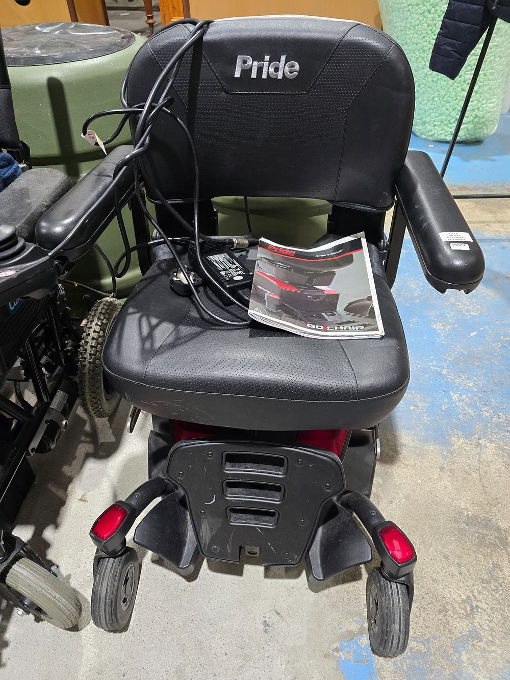 Lot 4: 1 X PRIDE MOBILITY GO CHAIR WITH CHARGER...
