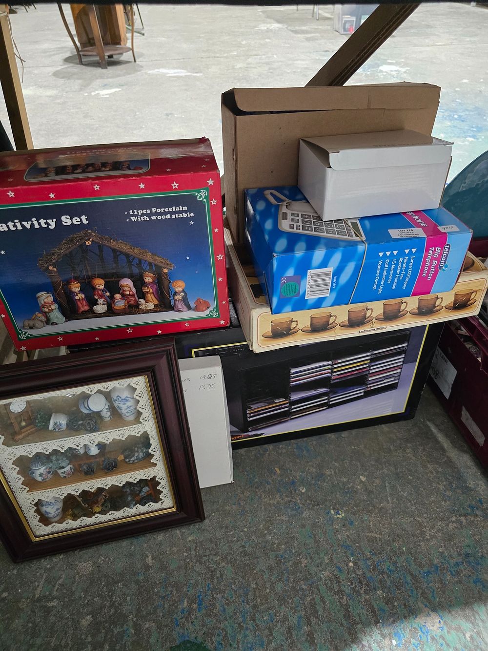 Lot 216: SELECTION OF BOXED GOODS TELEPHONES CD RACK ETC