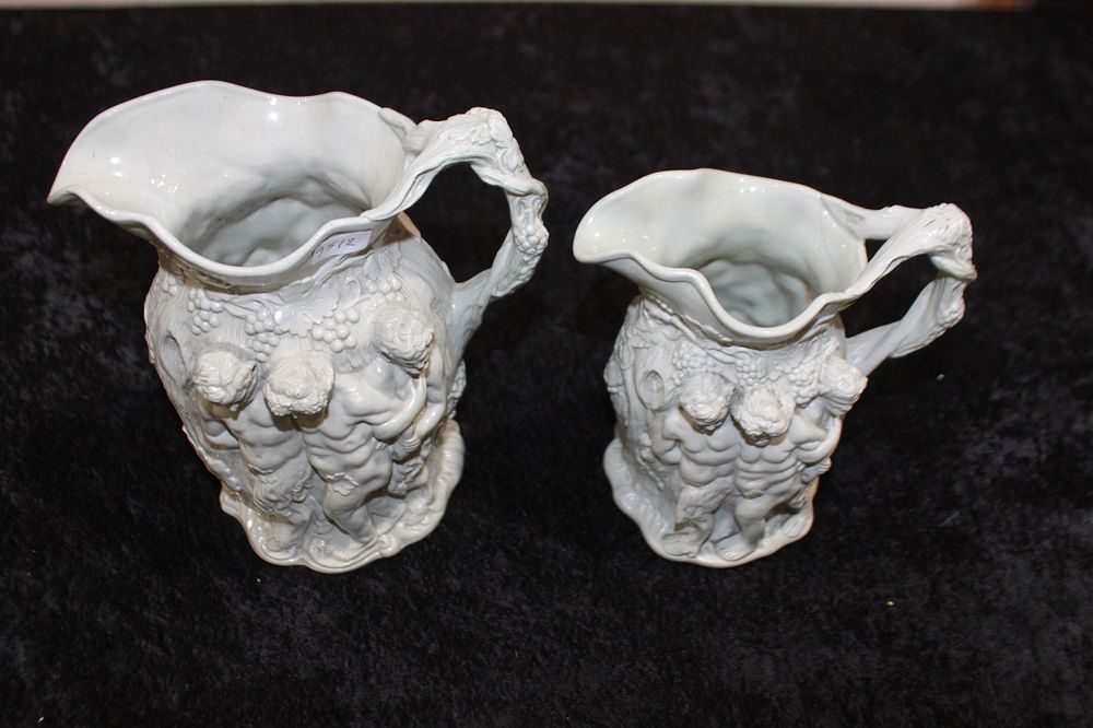 Lot 218: PAIR OF VICTORIAN RELIEF DECORATED WATER JUGS  THE...
