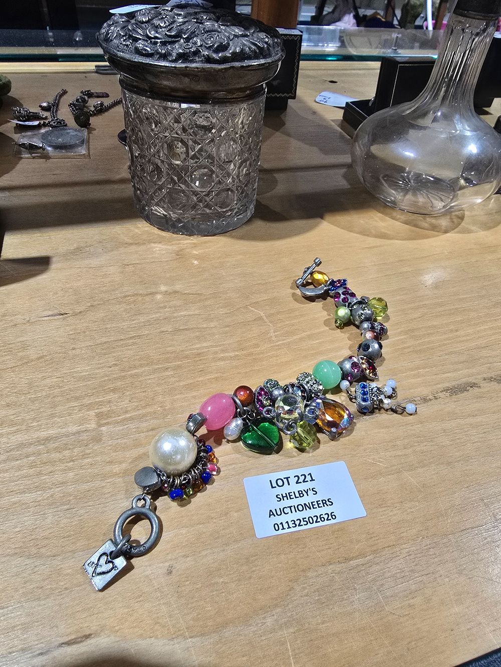 Lot 221: 1 X OTAZU SILVER CHARM BRACELET WITH VARIOUS...