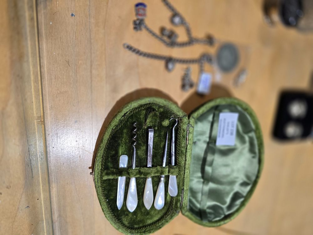 Lot 238: SELECTION OF SILVER WARE CHARMS WITH SILVER CHAINS...