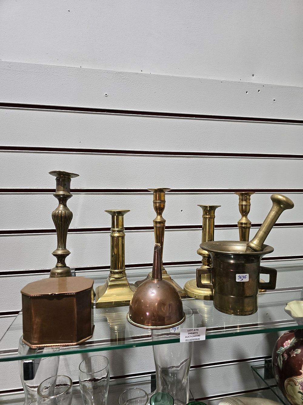 Lot 275: SELECTION OF BRASS CANDLE STICKS WITH BRASS PESTLE...
