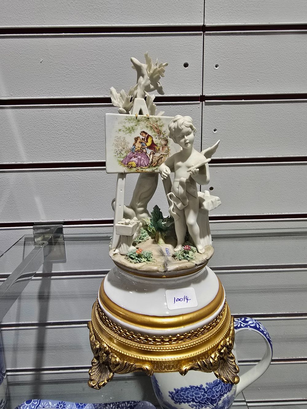 Lot 288: 1 X CAPODIMONTE CHERUB PAINTING FIGURINE