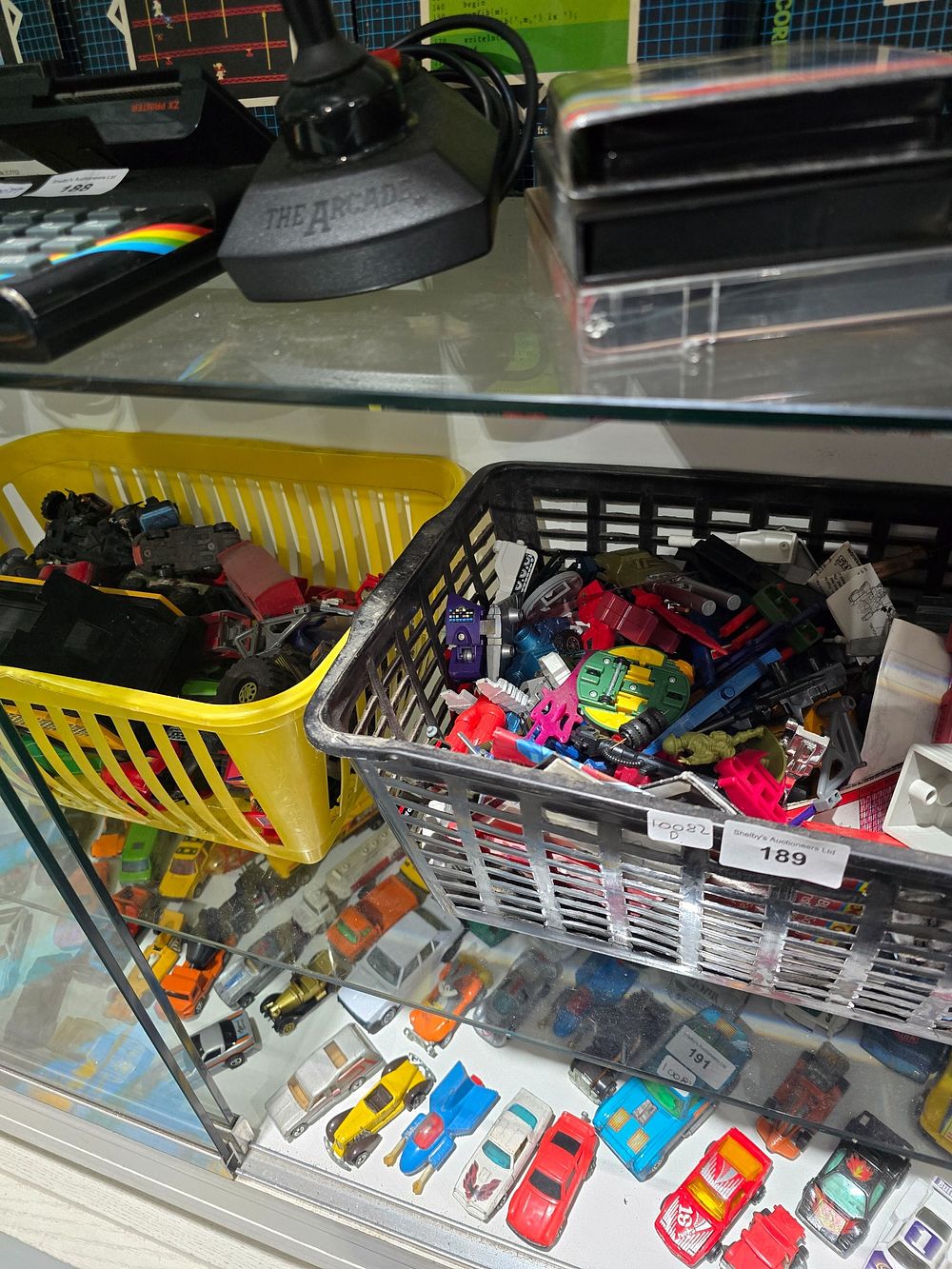 Lot 189: 2X BASKETS CONTAINING PLAYWORN VEHICLES AND TRANSFORMER ITEMS