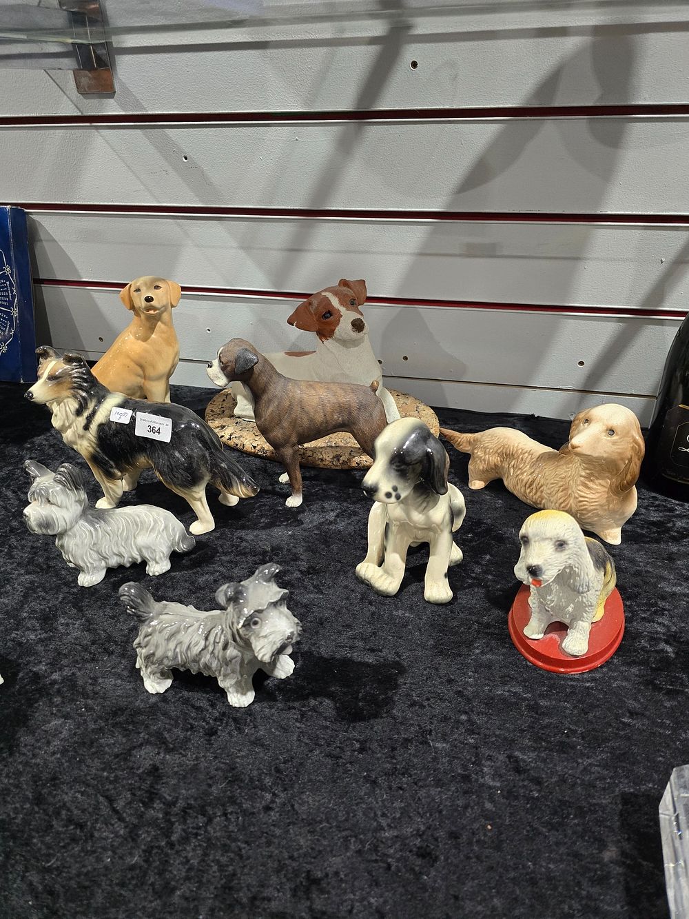 Lot 364: SELECTION OF VARIOUS POTTERY DOG FIGURINES