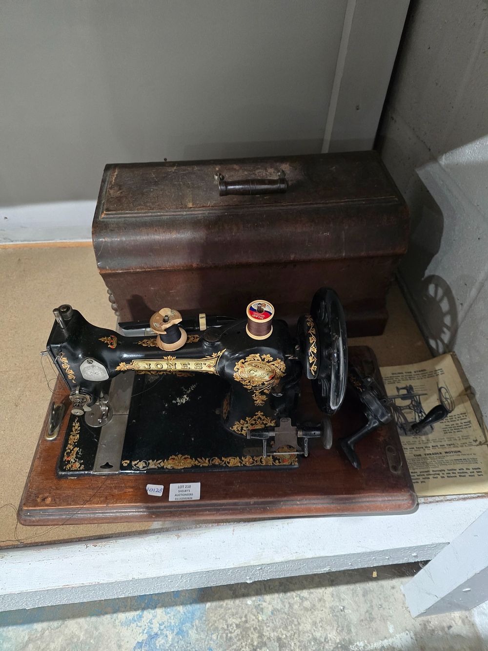 Lot 210: 1 X VINTAGE JONES SEWING MACHINE HAND POWERED