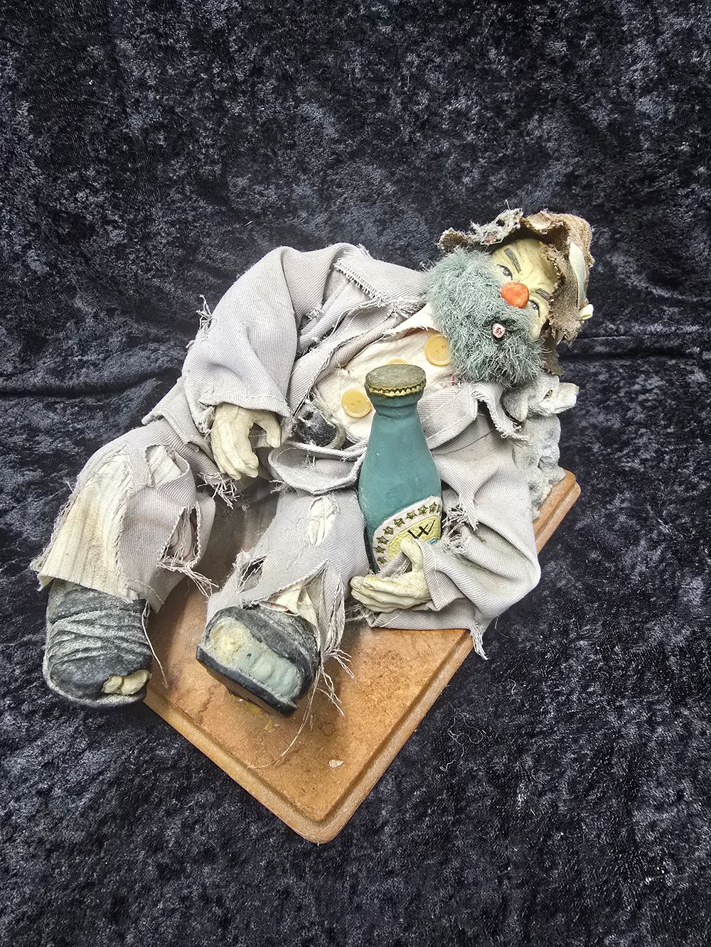 Lot 188: tramp on bench figurine